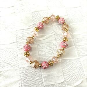 Bracelet pink bejeweled beads. Fits wrist up to 8 inches. NWT